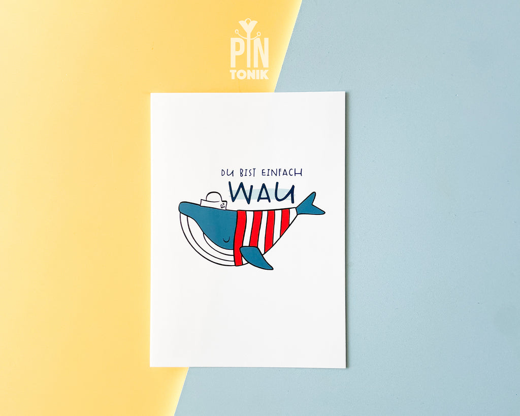 Premium postcard with an original illustration of a blue whale wearing a red striped shirt and a sailor hat with the text 'DU BIST EINFACH WAU'.