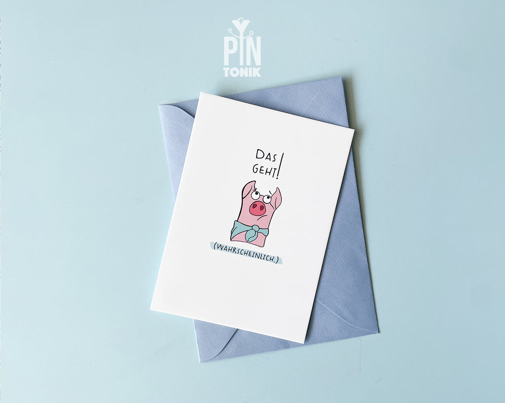 Premium postcard featuring an original illustration of a pink pig wearing a blue scarf with the German text 'Das geht! (Wahrscheinlich.)', shown with a blue envelope on a blue background.