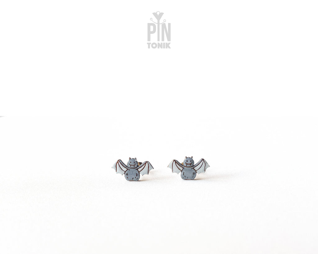 Handmade wooden grey bat stud earrings with outstretched wings by PinTonik, playful spooky and animal themed jewelry.