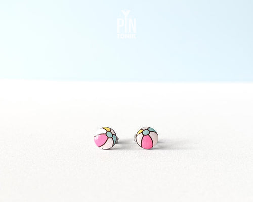 Handmade wooden beach ball stud earrings featuring a cheerful striped pattern of pink, white, and gray panels by PinTonik.