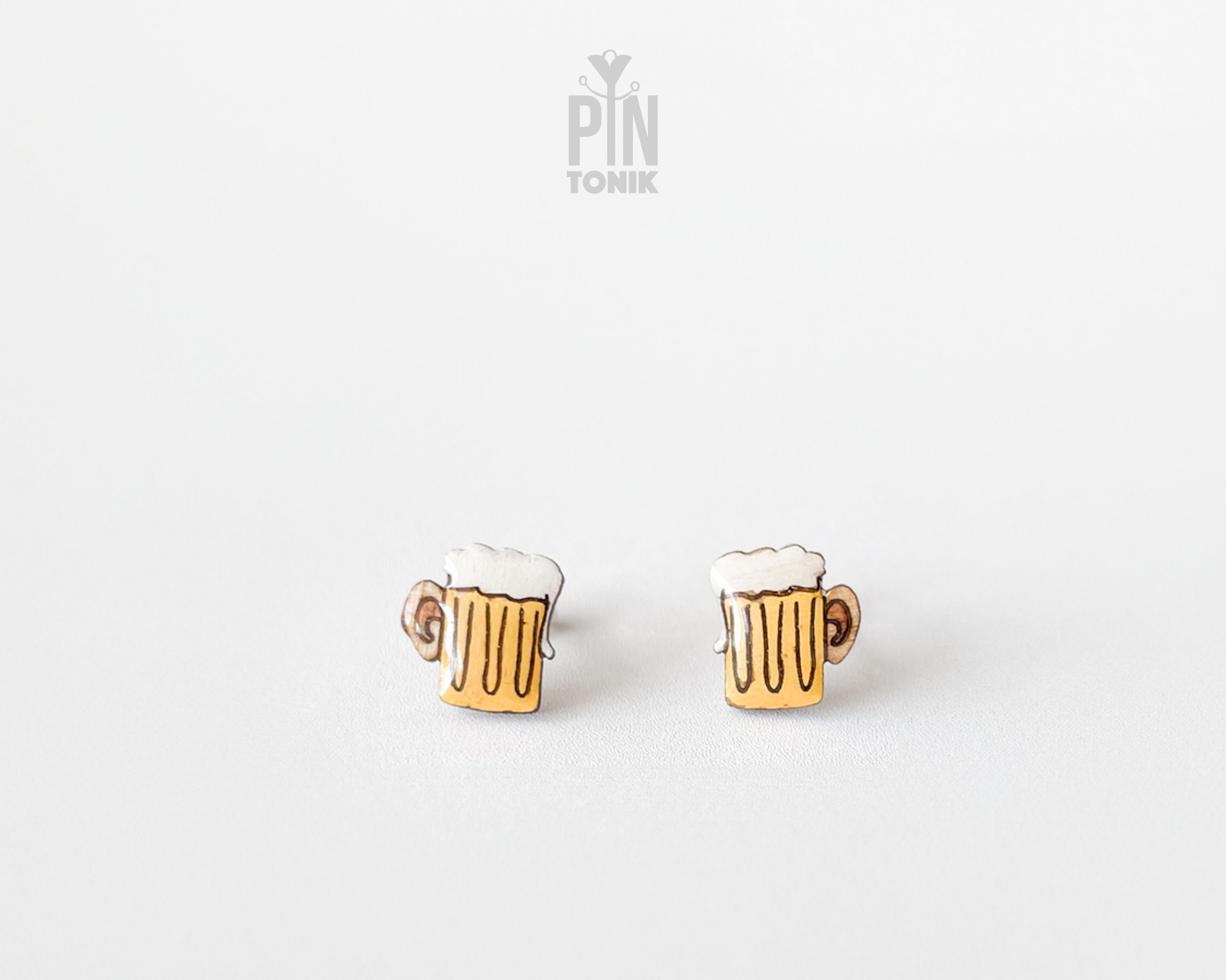 Handmade wooden beer mug stud earrings with golden beer and frothy white foam by PinTonik.