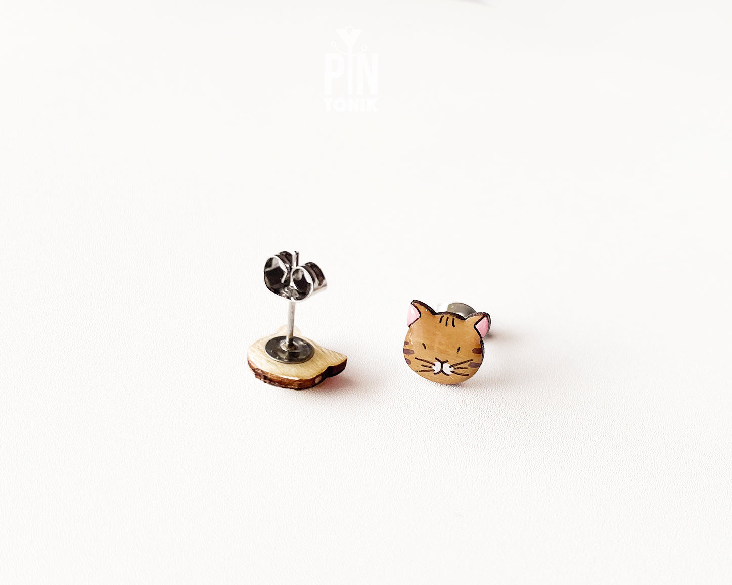 Pair of hand-painted ginger wooden cat stud earrings with a high-gloss protective resin finish