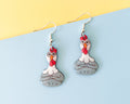 Large hand-painted wooden chicken dangle earrings with a grumpy expression and sterling silver hooks