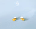 Handmade wooden hatching chick stud earrings with a tiny white eggshell on their head by PinTonik, cute spring and Easter themed jewelry.