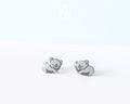 Pair of hand-painted wooden koala stud earrings featuring a sleeping design with closed eyes and pink ears