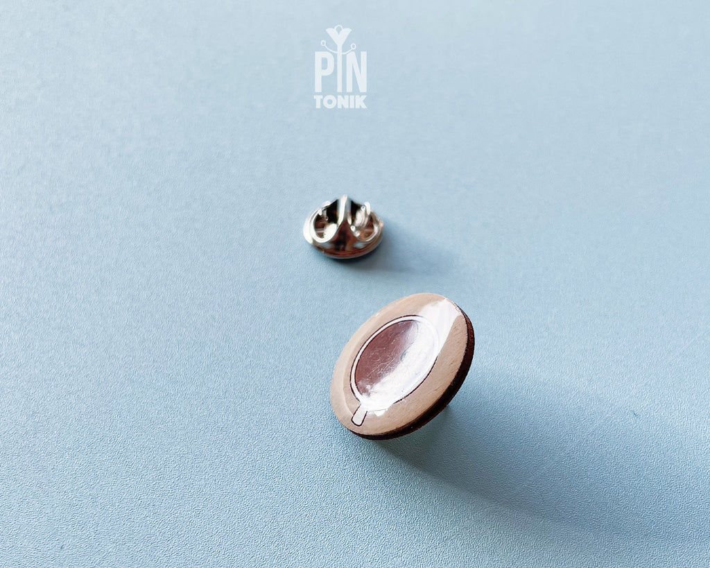 Hand-painted wooden coffee cup pin with latte art and a glossy resin finish