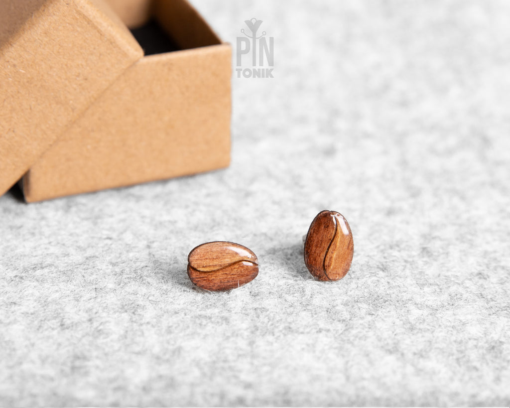 Handmade wooden roasted coffee bean stud earrings with a rich brown finish and realistic central fold detail by PinTonik.