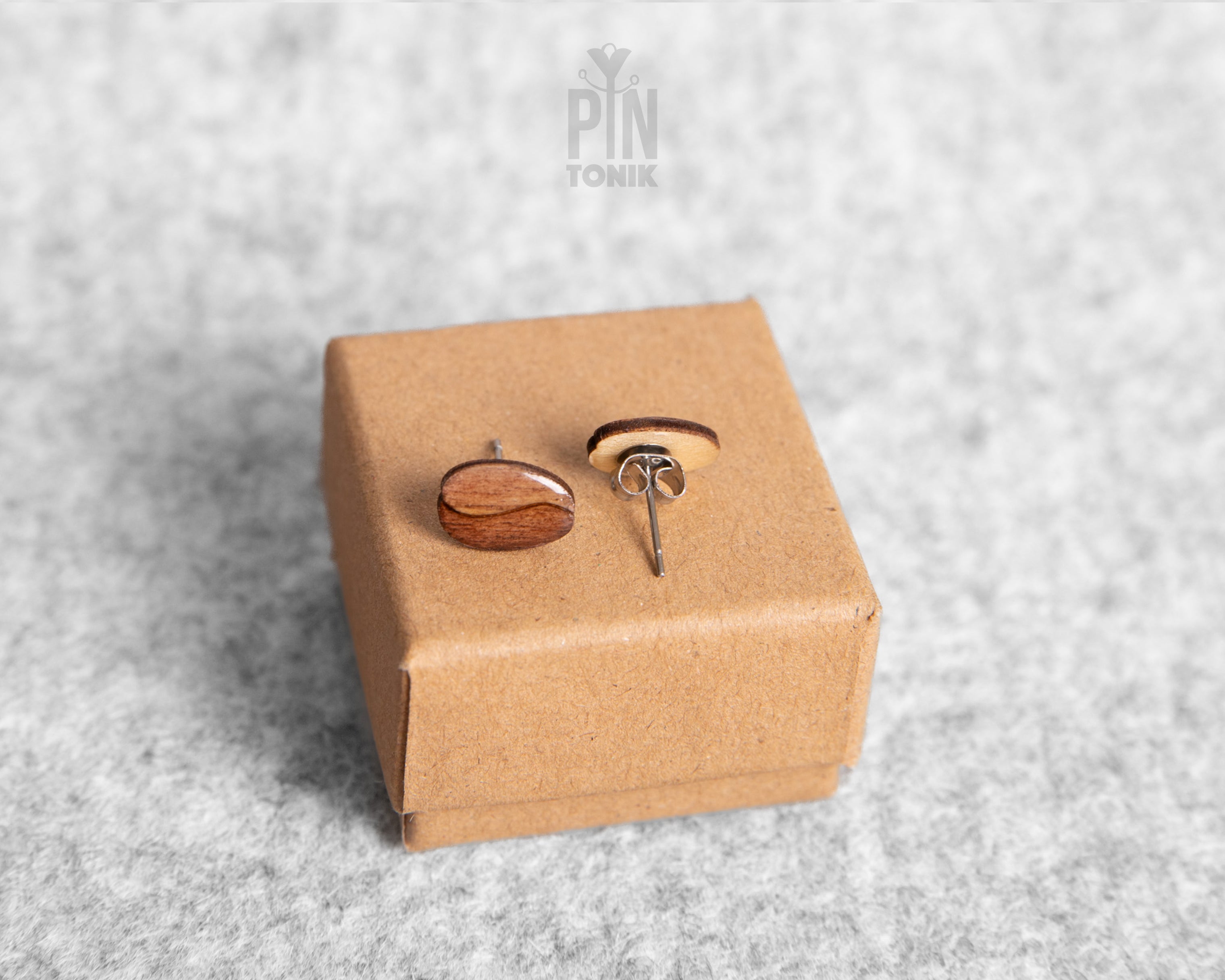 Handmade wooden roasted coffee bean stud earrings with a rich brown finish and realistic central fold detail by PinTonik.