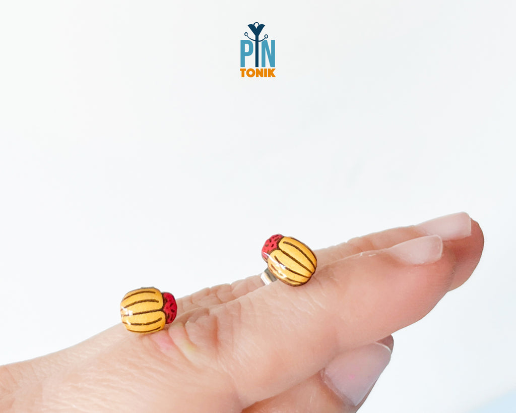 Handmade wooden Colorado potato beetle stud earrings with yellow and black stripes and a red head by PinTonik.