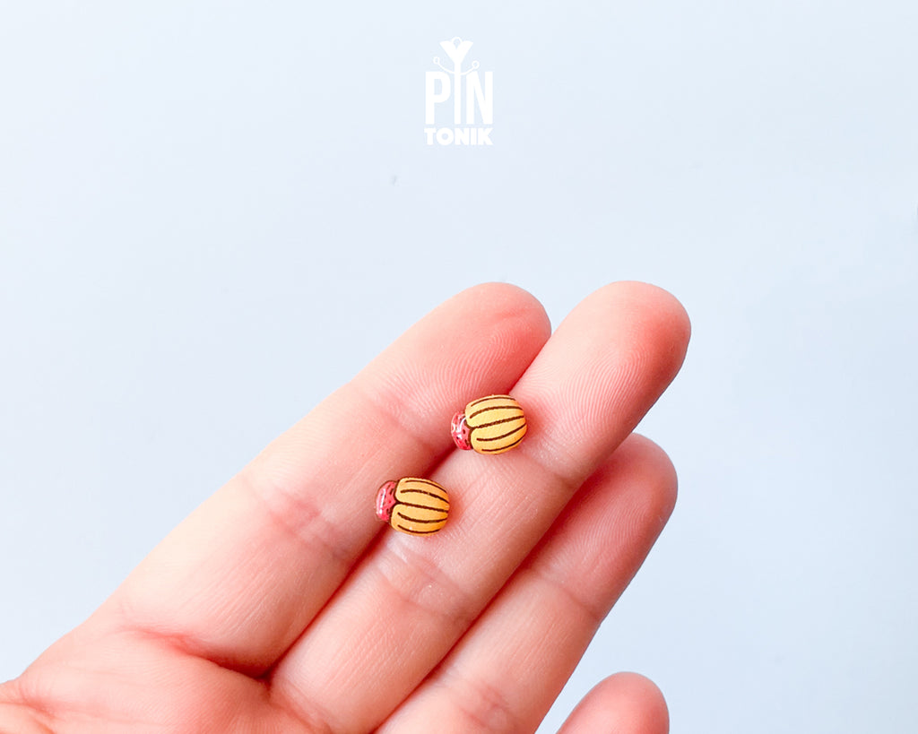 Handmade wooden Colorado potato beetle stud earrings with yellow and black stripes and a red head by PinTonik.