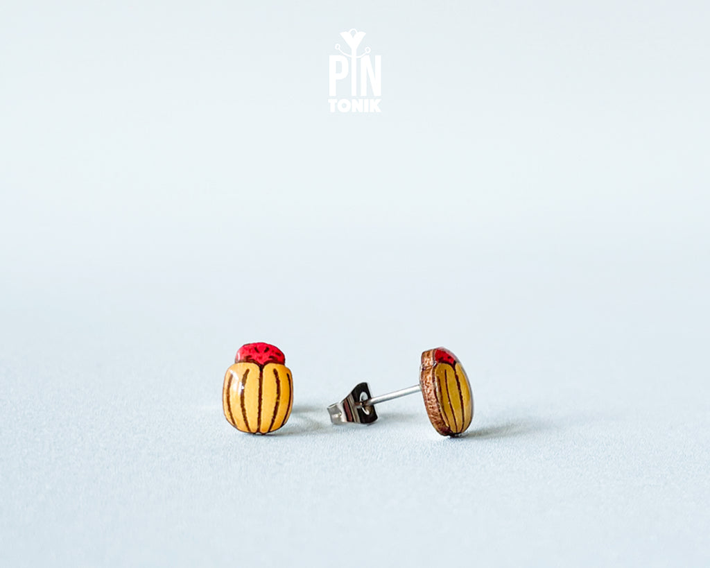 Handmade wooden Colorado potato beetle stud earrings with yellow and black stripes and a red head by PinTonik.