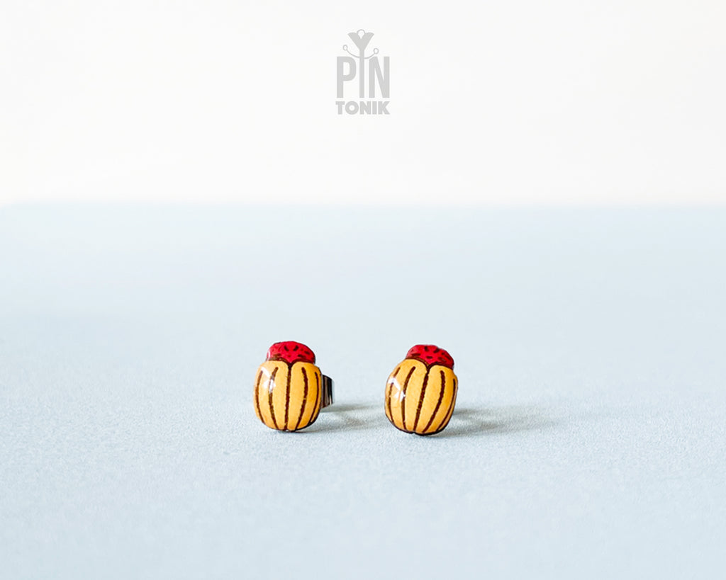 Handmade wooden Colorado potato beetle stud earrings with yellow and black stripes and a red head by PinTonik.