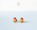 Handmade wooden Colorado potato beetle stud earrings with yellow and black stripes and a red head by PinTonik.