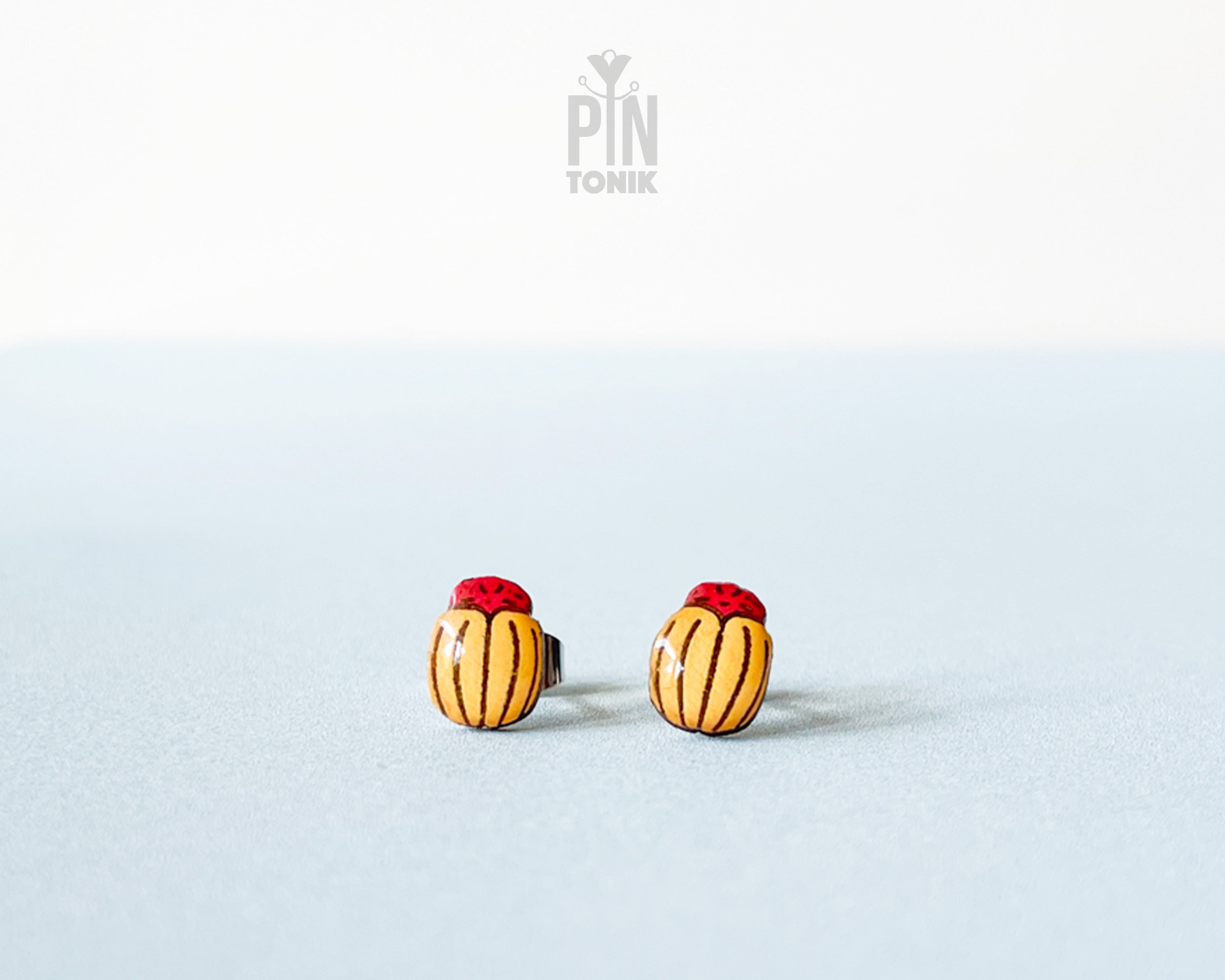 Handmade wooden Colorado potato beetle stud earrings with yellow and black stripes and a red head by PinTonik.