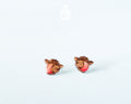 Handmade wooden alpine cow head stud earrings with detailed spots by PinTonik, rustic farmhouse animal themed jewelry.