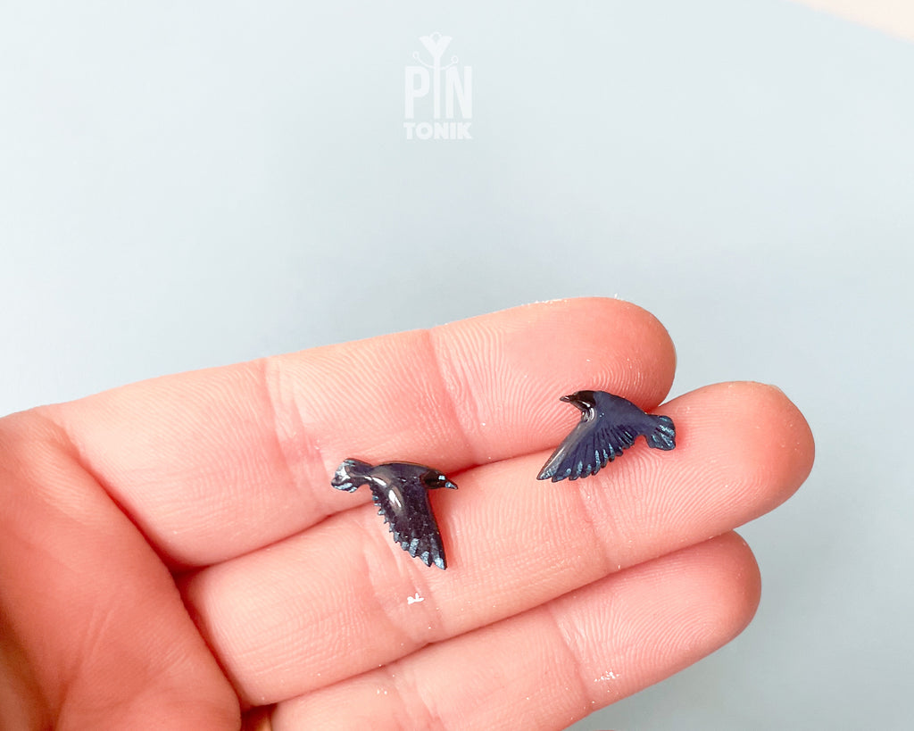 Handmade wooden raven stud earrings in flight with dark blue-black wings by PinTonik, gothic nature and wild bird themed jewelry.
