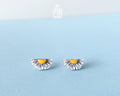 Minimalist half-daisy flower character stud earrings by PinTonik, hand-made in Austria.