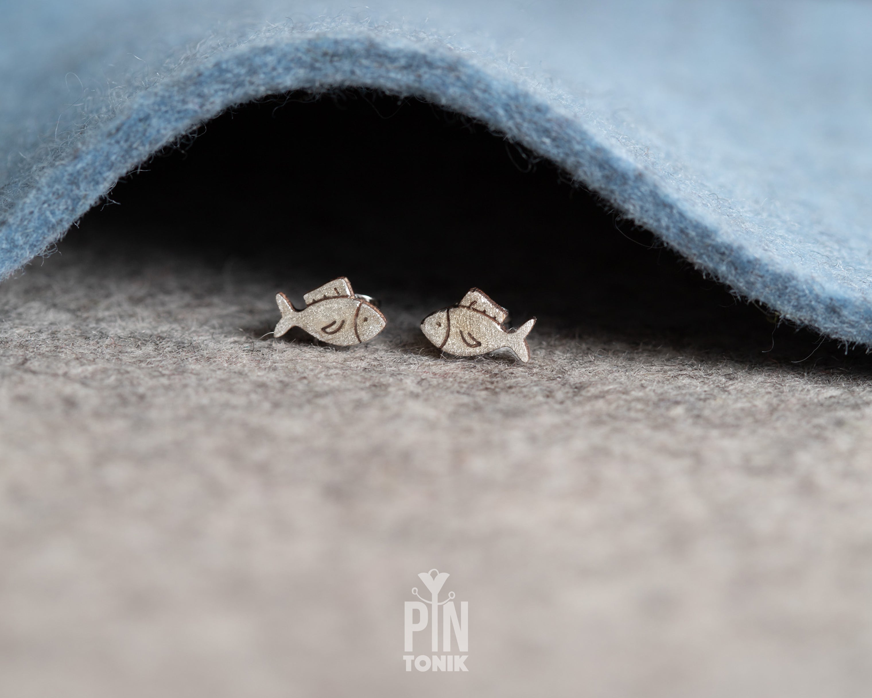 Handmade wooden hatching chick stud earrings with a tiny white eggshell on their head by PinTonik, cute spring and Easter themed jewelry.