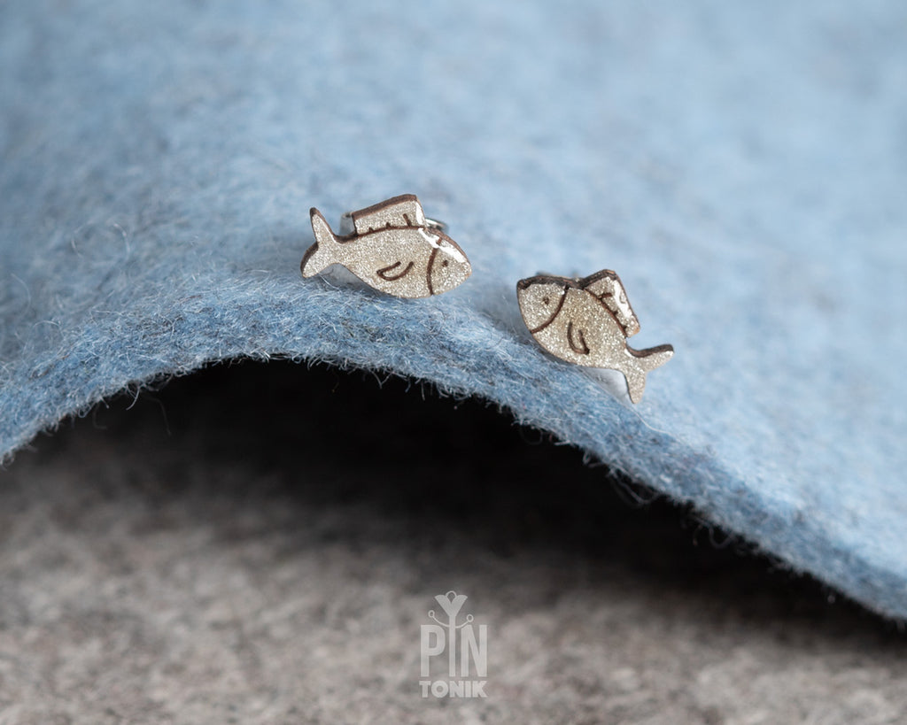 Handmade wooden hatching chick stud earrings with a tiny white eggshell on their head by PinTonik, cute spring and Easter themed jewelry.