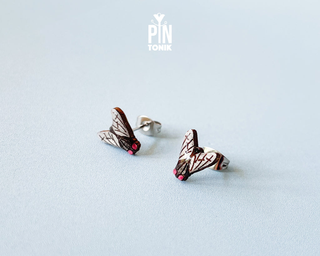 Handmade wooden house fly stud earrings with detailed wings and a black body by PinTonik.