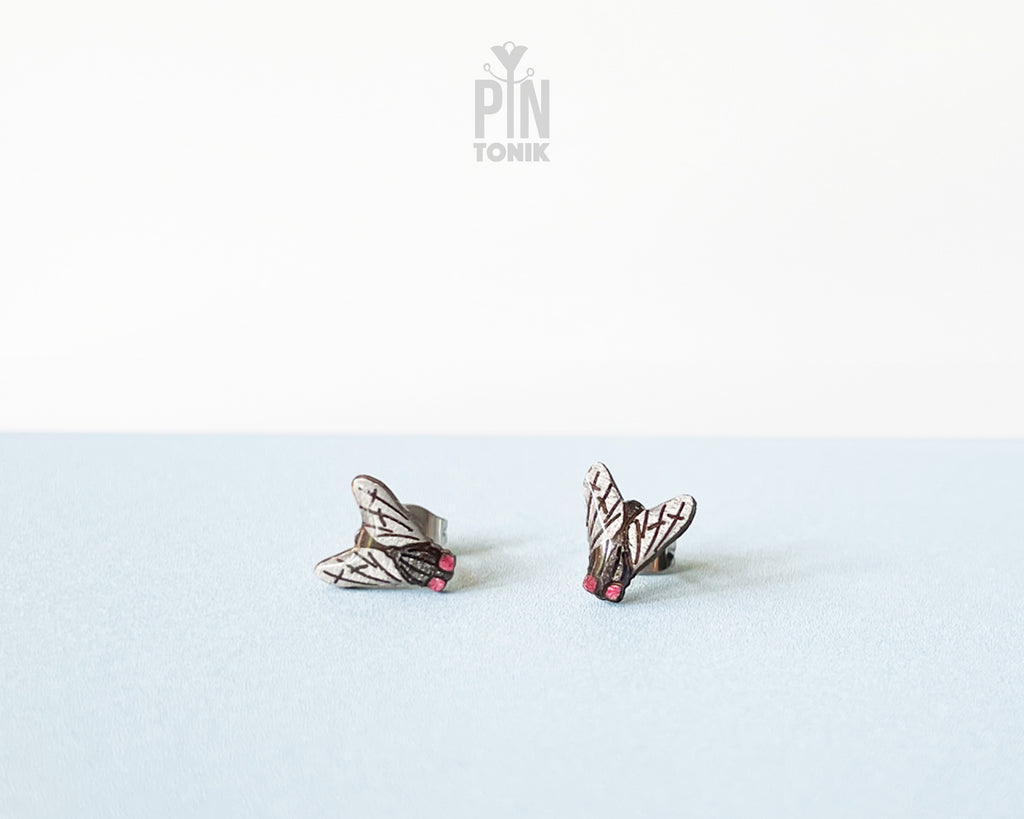 Handmade wooden house fly stud earrings with detailed wings and a black body by PinTonik.