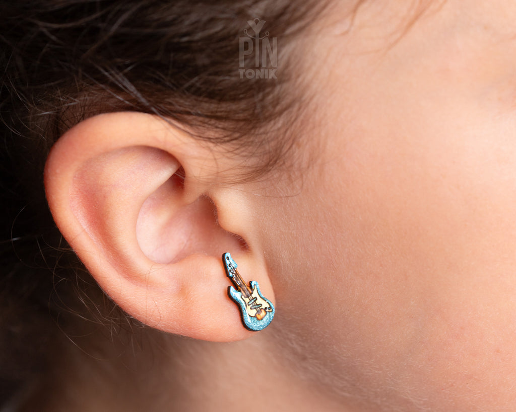 Handmade wooden electric guitar stud earrings with a blue sunburst finish and detailed neck illustration by PinTonik.