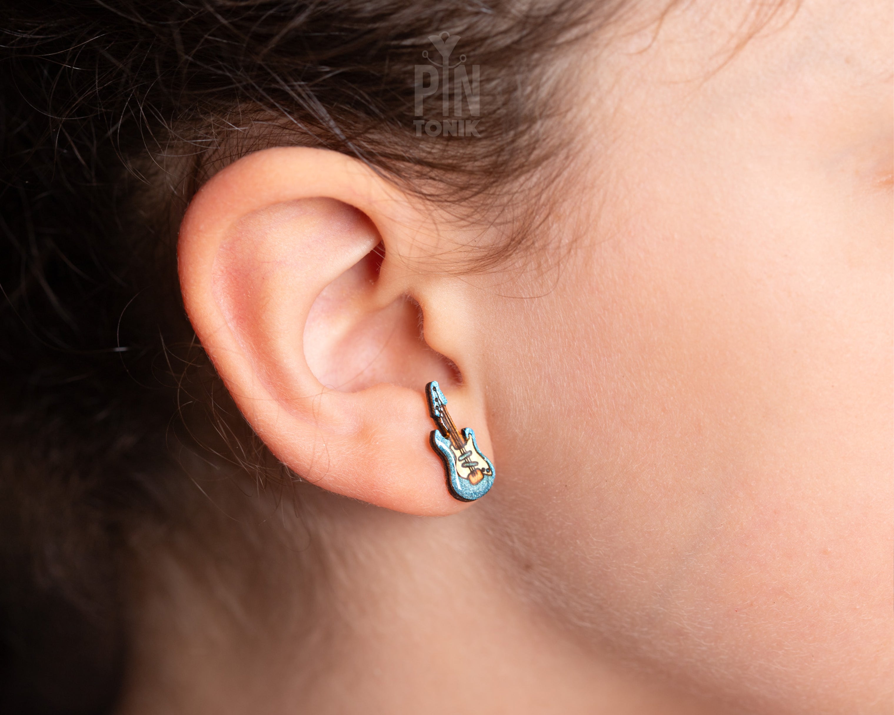 Handmade wooden electric guitar stud earrings with a blue sunburst finish and detailed neck illustration by PinTonik.