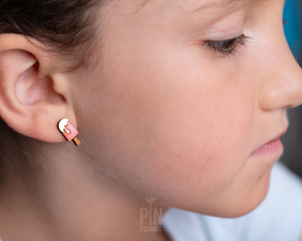 Handmade wooden pink popsicle stud earrings with a melting white cream topping and a tiny wooden stick by PinTonik
