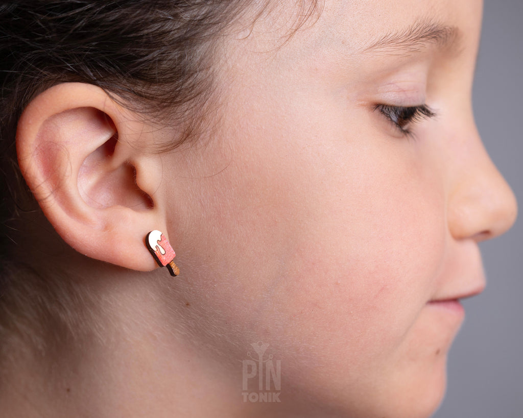 Handmade wooden pink popsicle stud earrings with a melting white cream topping and a tiny wooden stick by PinTonik
