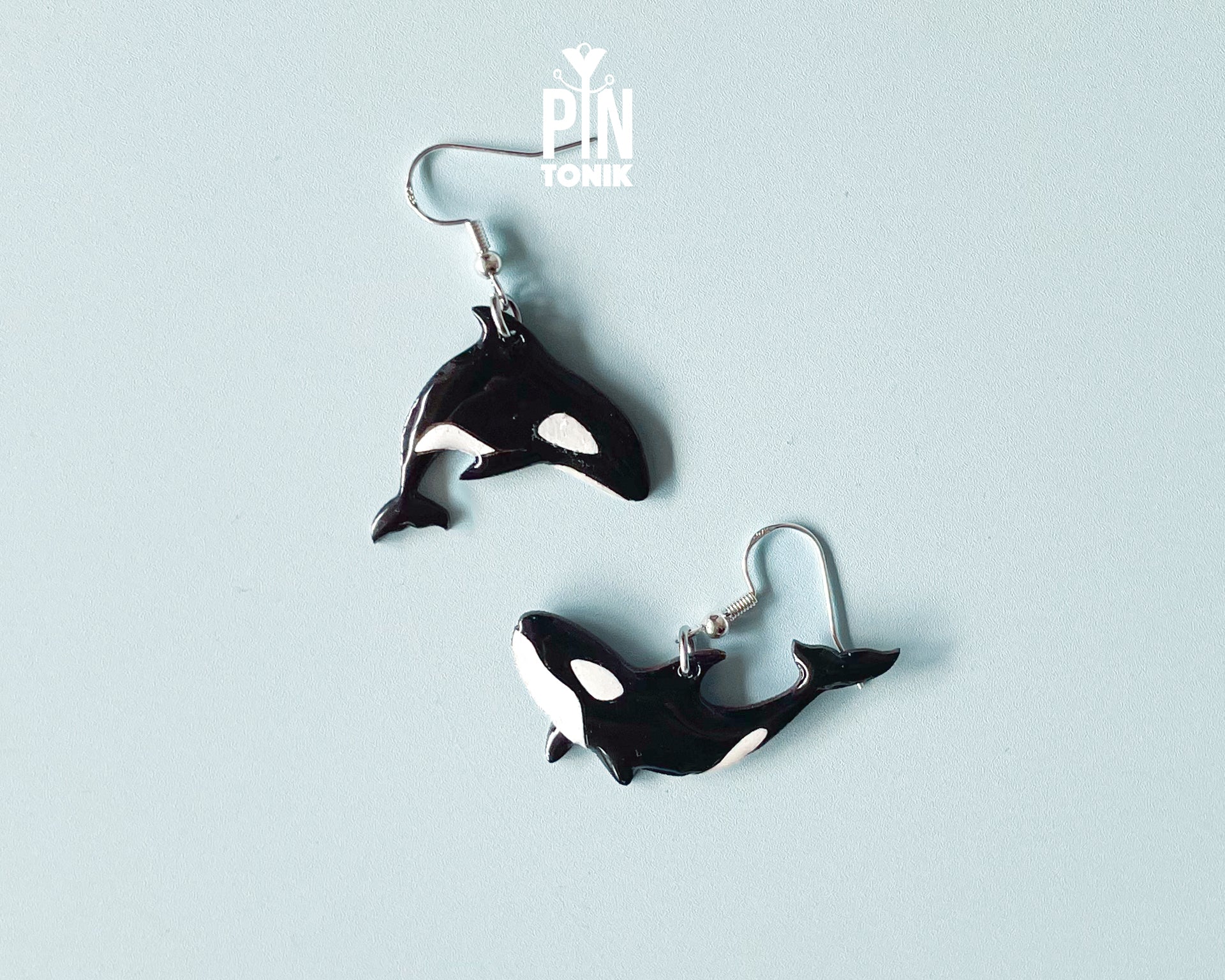 Hand-painted wooden orca whale dangle earrings on sterling silver hooks with a glossy resin finish