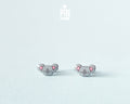 Pair of hand-painted wooden koala stud earrings with pink ears and peaceful closed eyes, finished with glossy resin