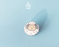 Hand-painted wooden sheep pin with a fluffy white wool design and a high-gloss resin finish