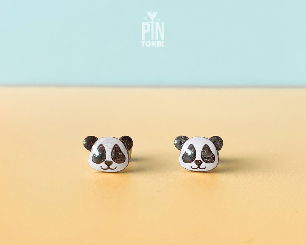 Pair of hand-painted wooden panda face stud earrings with a high-gloss resin finish