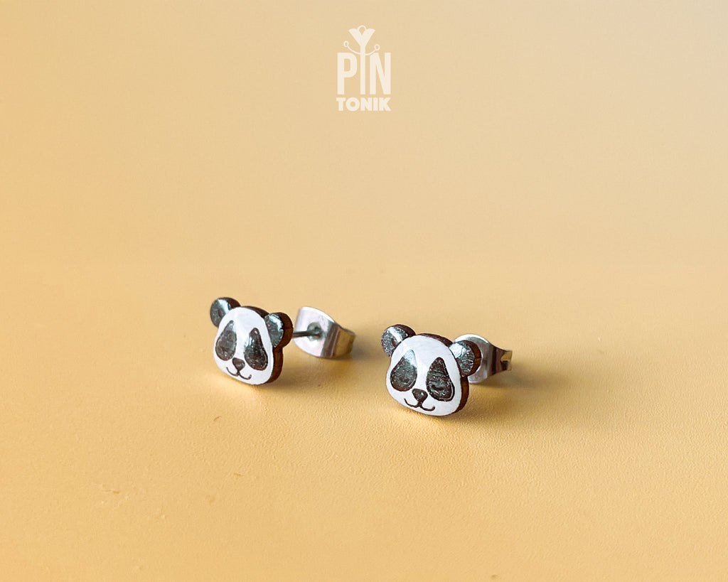 Pair of hand-painted wooden panda face stud earrings with a high-gloss resin finish