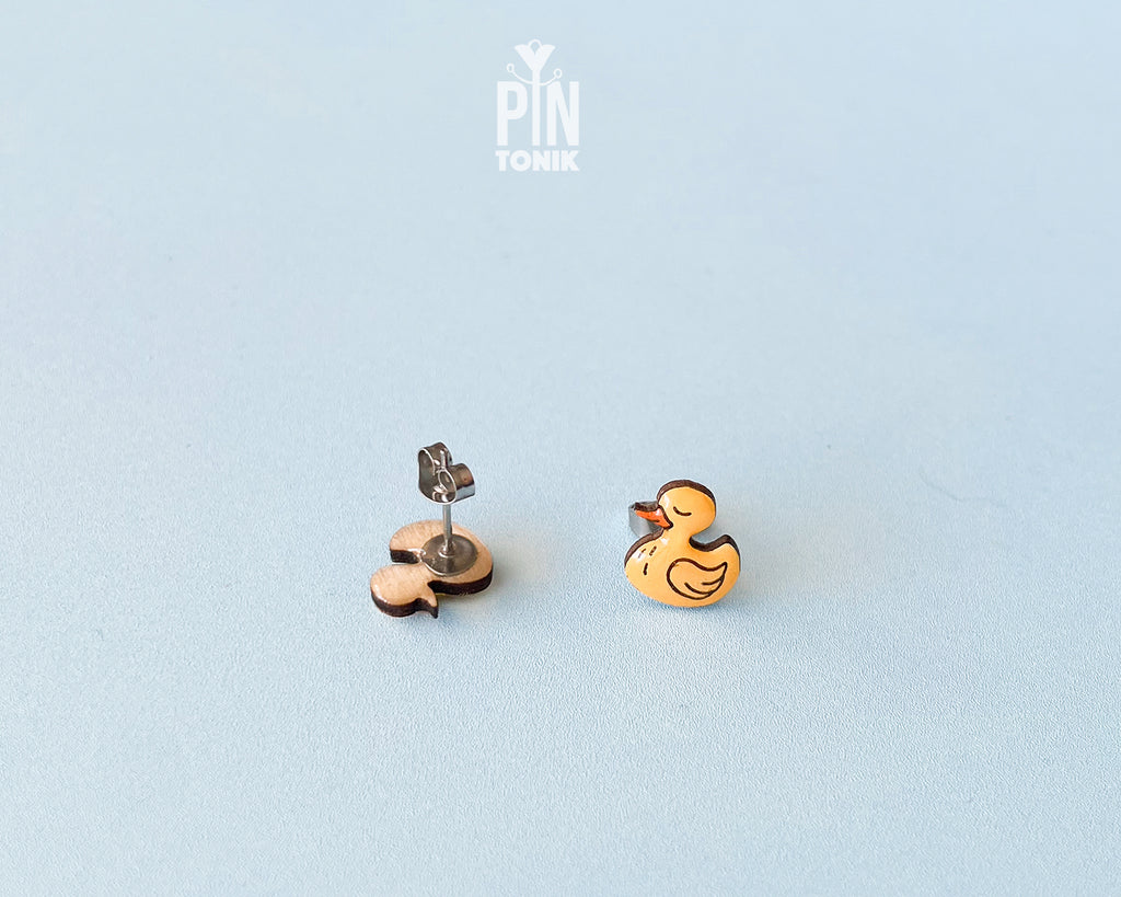Pair of hand-painted yellow wooden duck stud earrings with a high-gloss resin finish