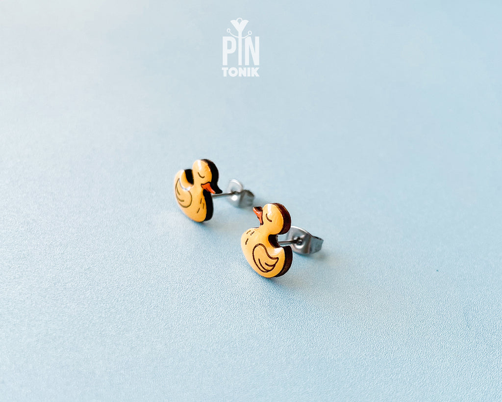 Pair of hand-painted yellow wooden duck stud earrings with a high-gloss resin finish