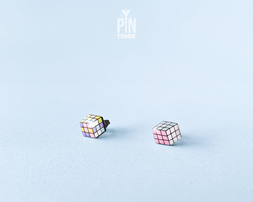 Handmade wooden magic Cube stud earrings showing a three-dimensional perspective with colorful pastel grids by PinTonik