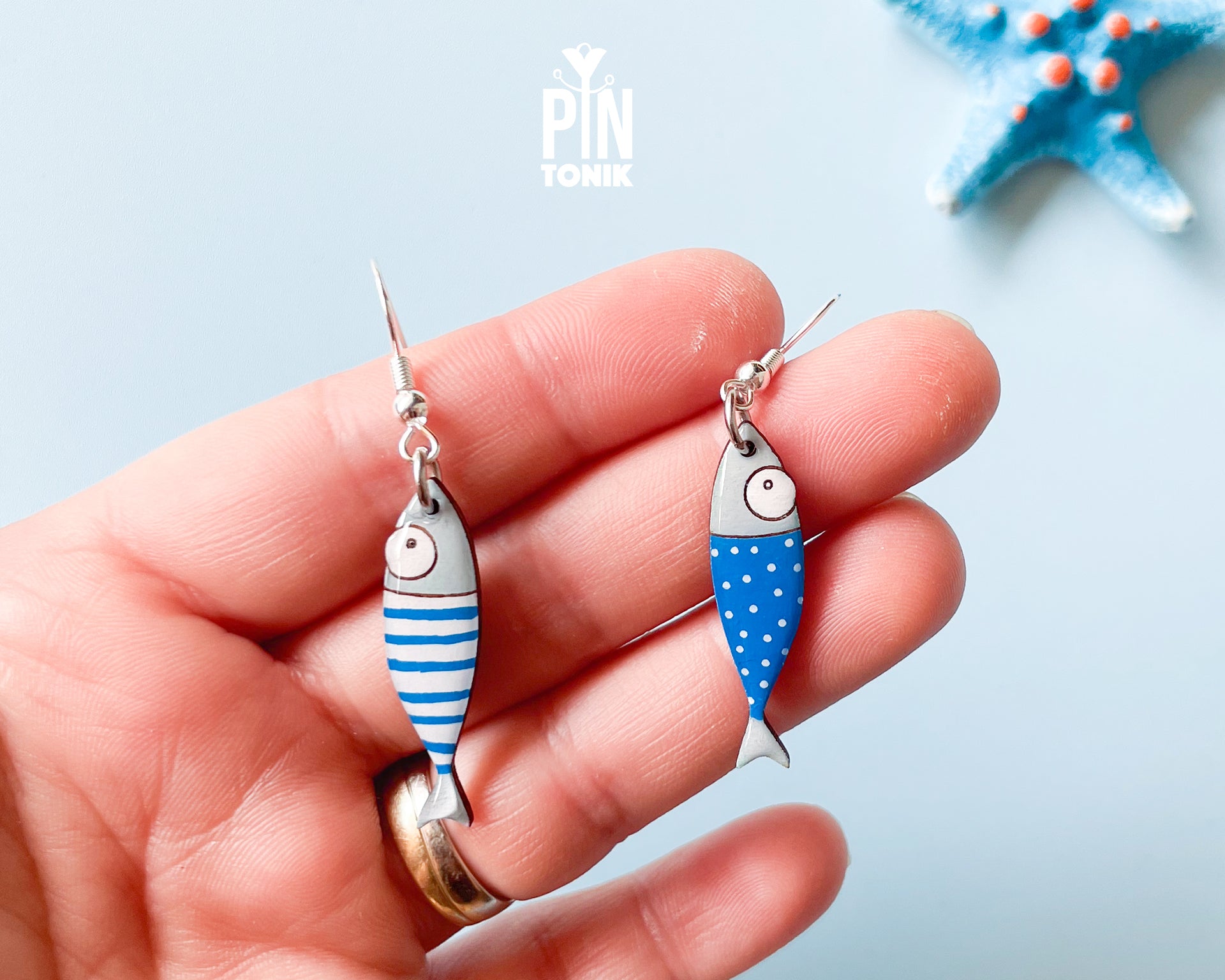 Hand-painted wooden sardine dangle earrings in various colors (blue, red, striped) on sterling silver hooks