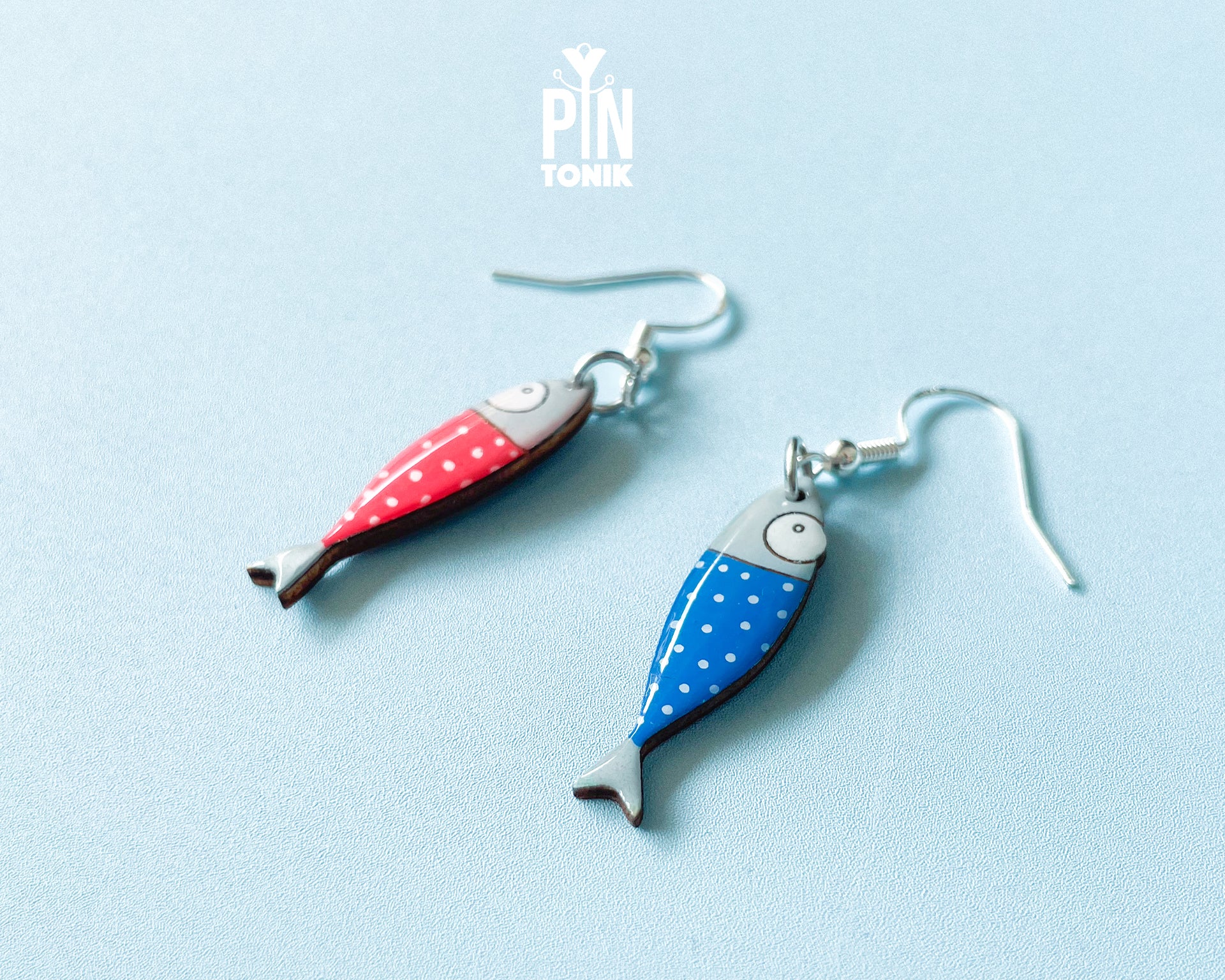 Hand-painted wooden sardine dangle earrings in various colors (blue, red, striped) on sterling silver hooks