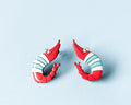 Pair of hand-painted wooden shrimp stud earrings with red and teal stripes and funny wide eyes