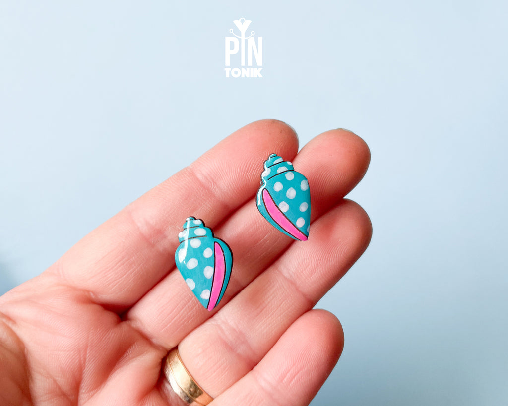 Handmade oversized wooden scallop shell stud earrings in pastel blue with bright pink accent lines by PinTonik.