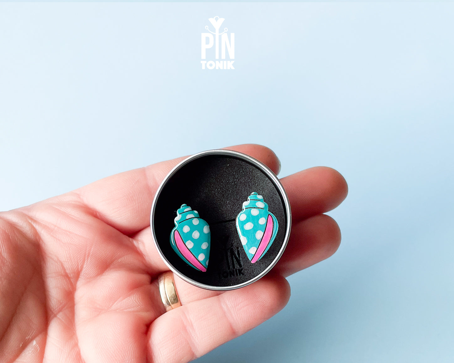 Handmade oversized wooden scallop shell stud earrings in pastel blue with bright pink accent lines by PinTonik.
