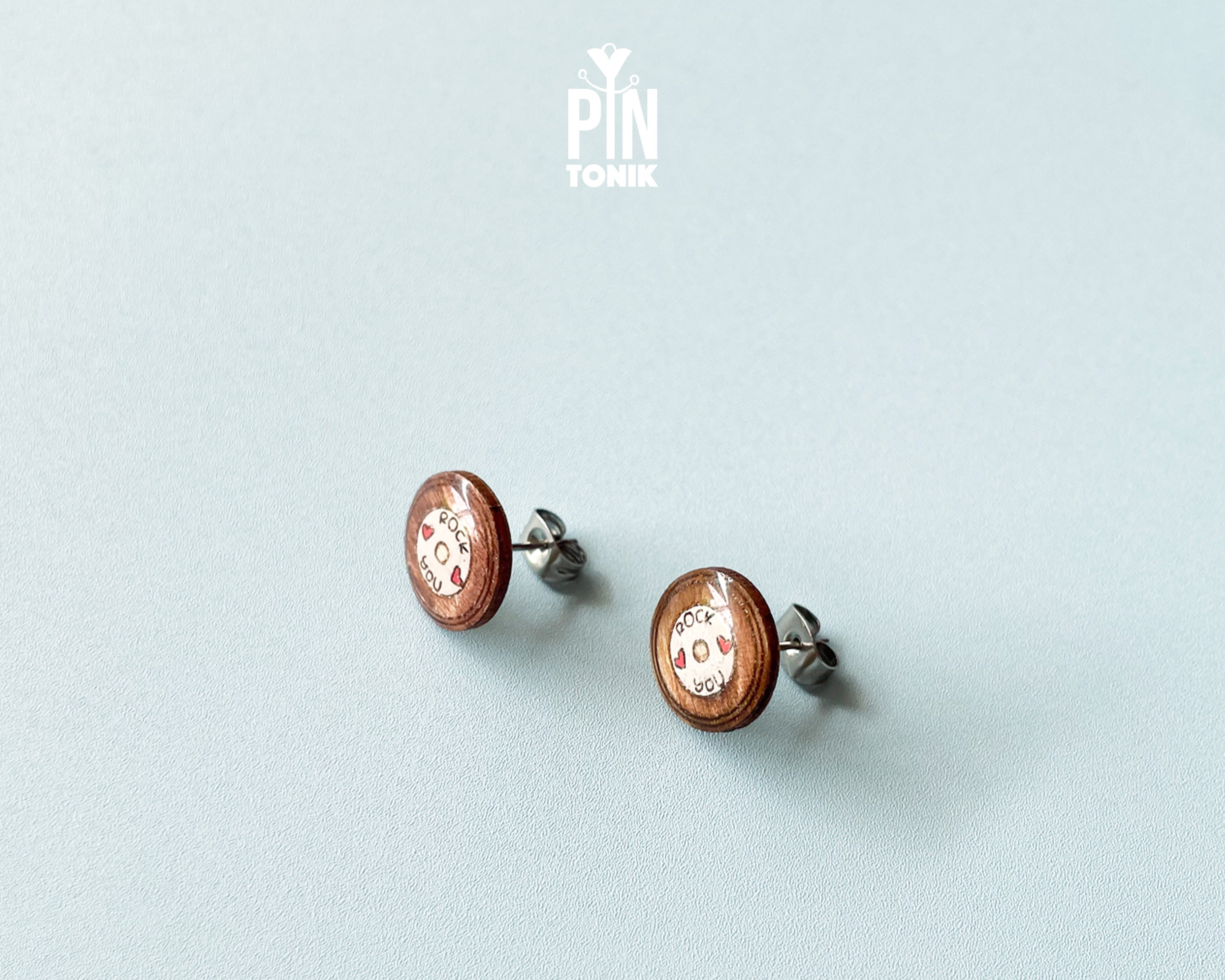 Handmade wooden vinyl record stud earrings in vintage brown with a center label reading 'ROCK ❤️ YOU' by PinTonik.