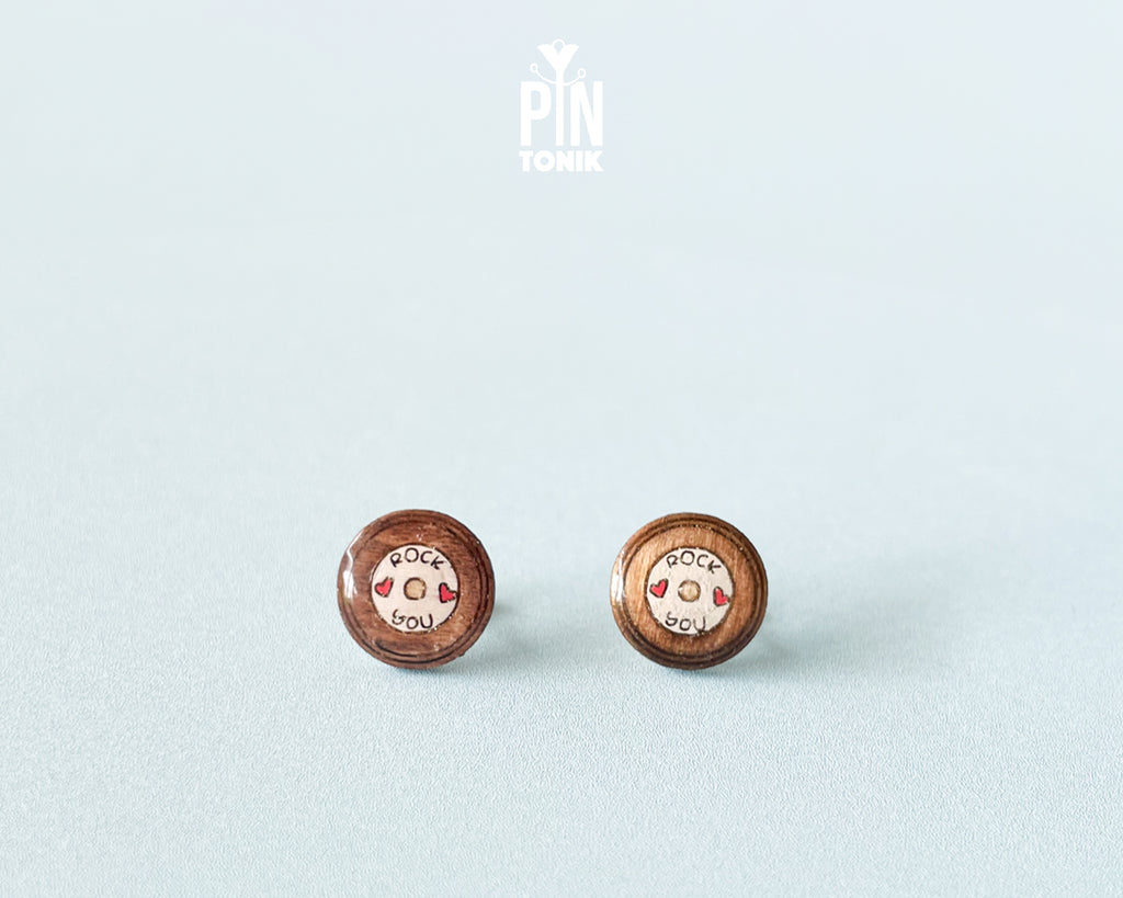 Handmade wooden vinyl record stud earrings in vintage brown with a center label reading 'ROCK ❤️ YOU' by PinTonik.