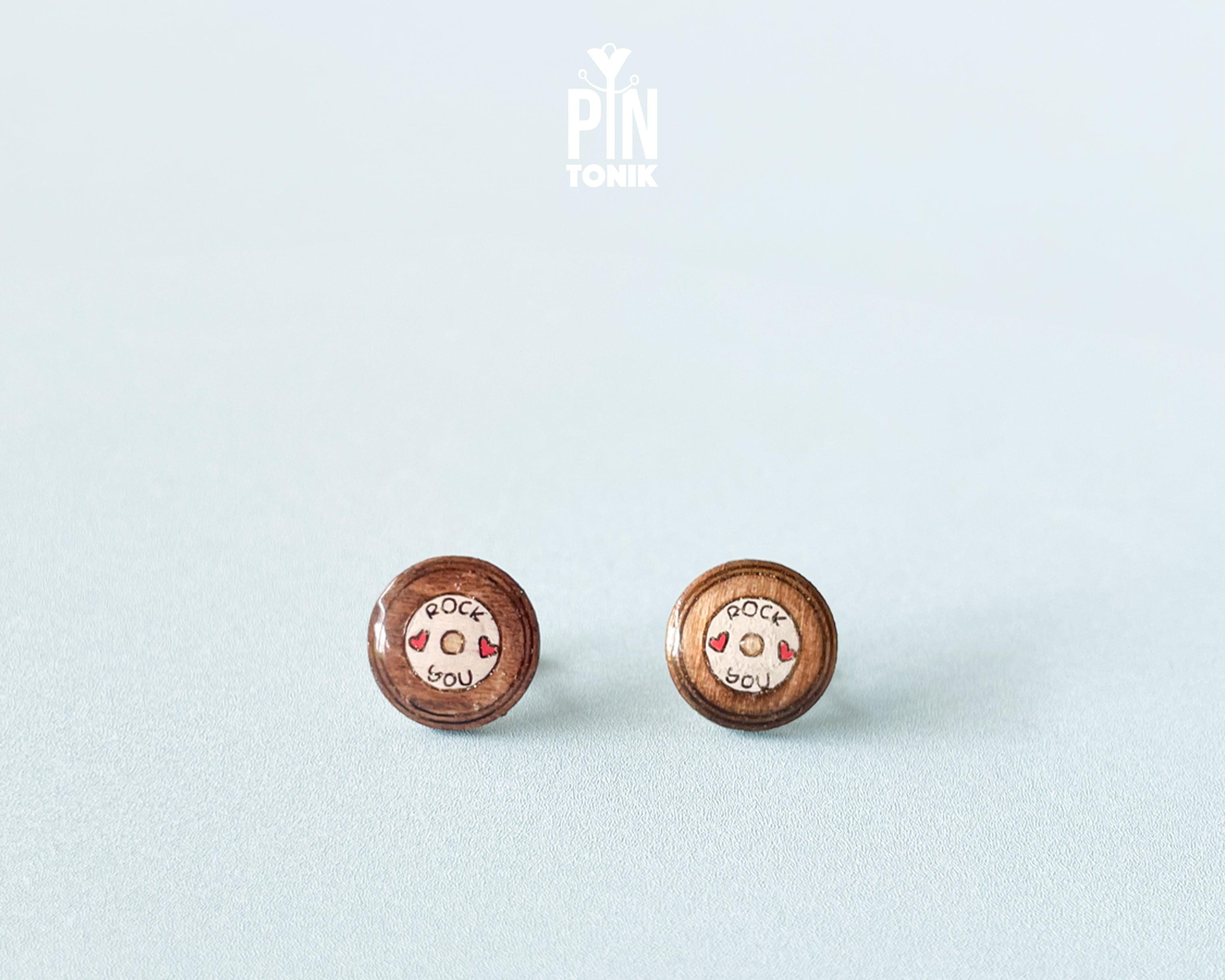 Handmade wooden vinyl record stud earrings in vintage brown with a center label reading 'ROCK ❤️ YOU' by PinTonik.