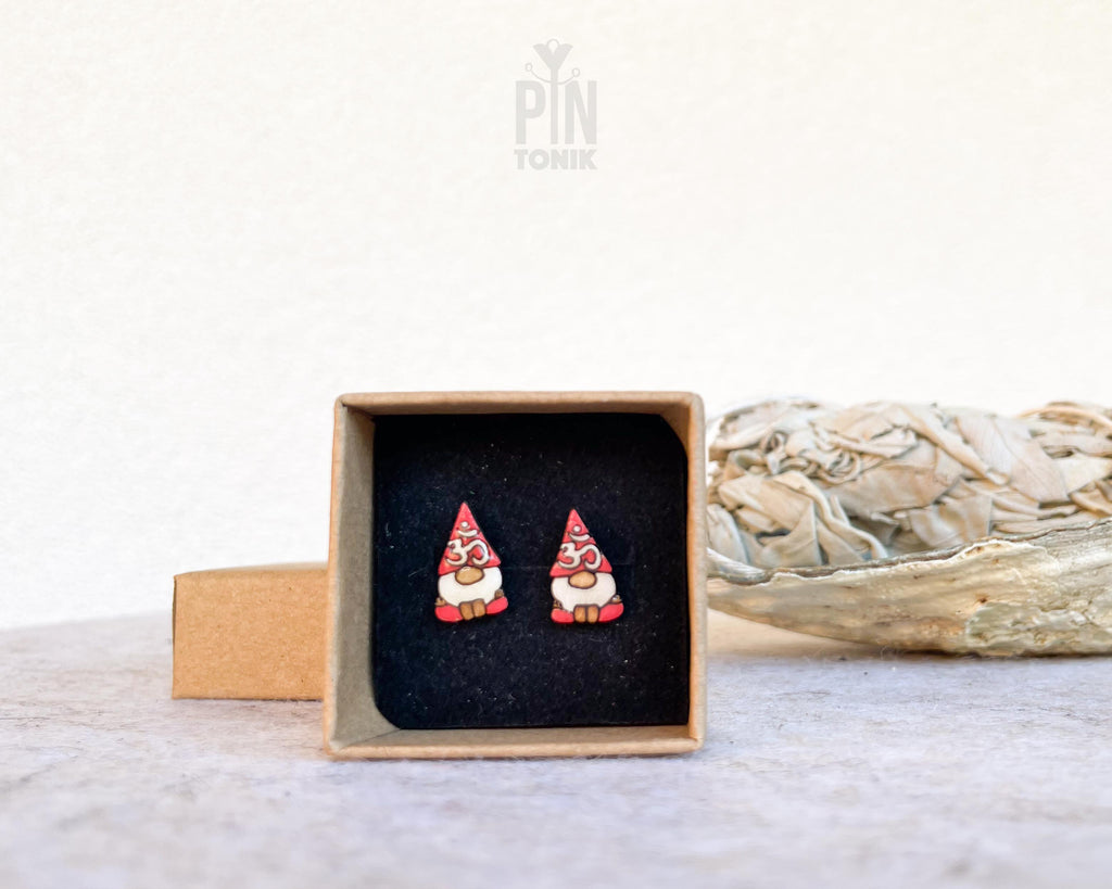 "Handmade wooden garden gnome stud earrings featuring traditional figures with pointy red hats and white beards by PinTonik."