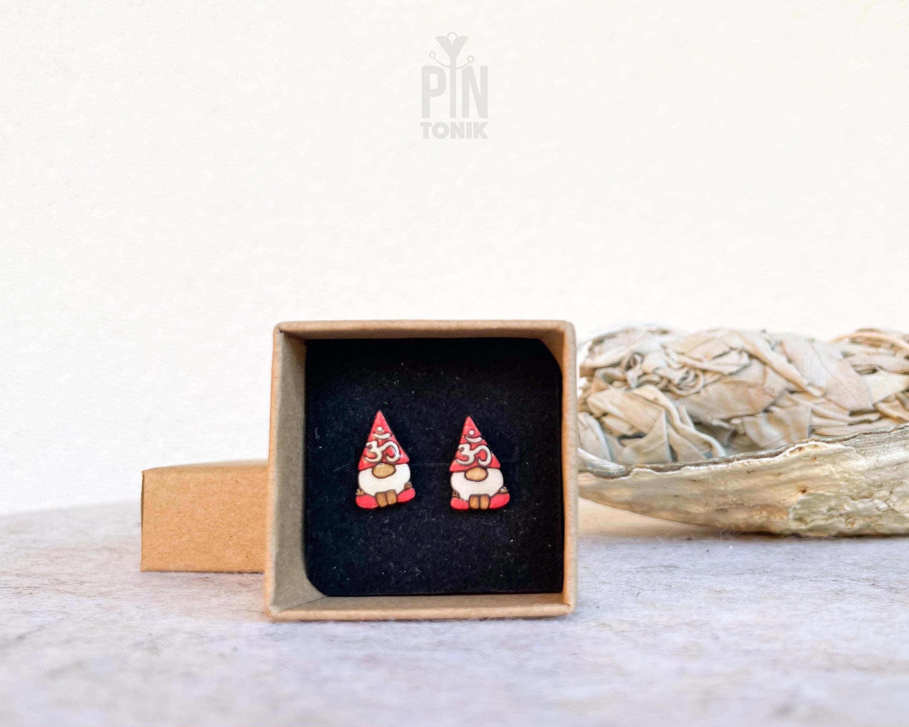 "Handmade wooden garden gnome stud earrings featuring traditional figures with pointy red hats and white beards by PinTonik."